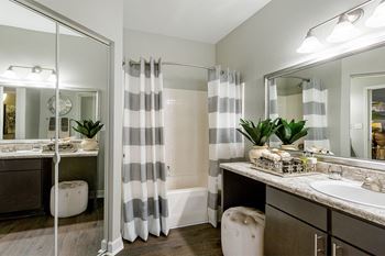 Bathroom with sink and shower with curtain